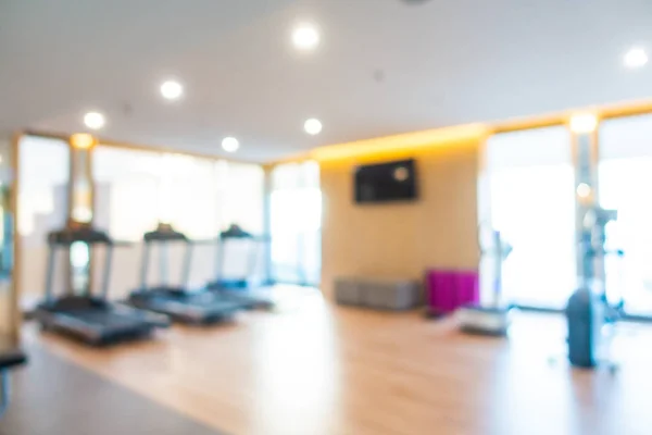 Abstract blur gym room interior with fitness equipment — ストック写真