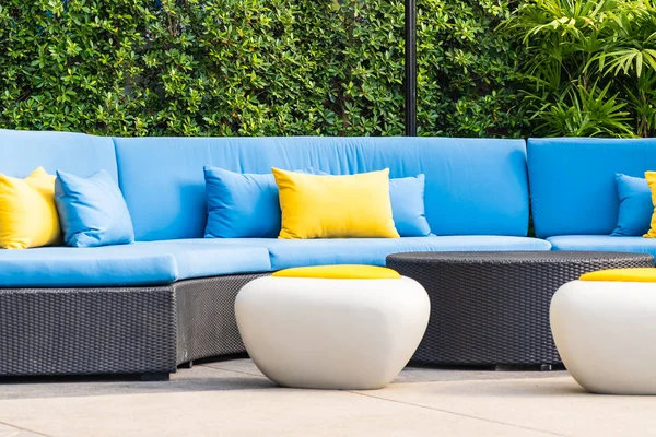 Outdoor patio in the garden with sofa chair and pillow decoratio