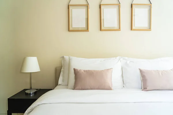 White comfortable pillow on bed decoration interior — ストック写真
