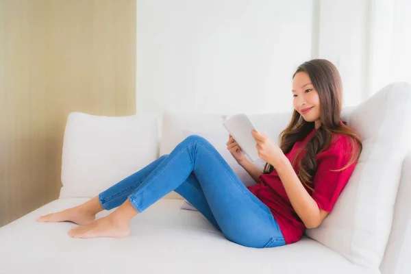 Portrait beautiful young asian women read book on sofa chair — Stock Photo, Image