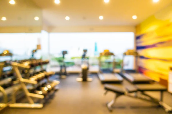 Abstract blur gym room interior with fitness equipment — ストック写真