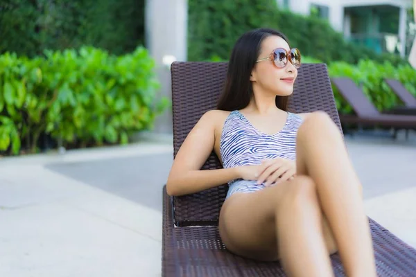 Beautiful young asian women happy smile relax around outdoor swi — 스톡 사진