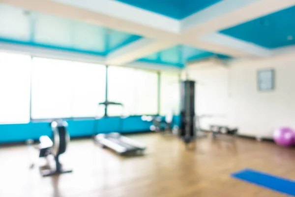 Abstrato borrão ginásio quarto interior com equipamento de fitness — Fotografia de Stock
