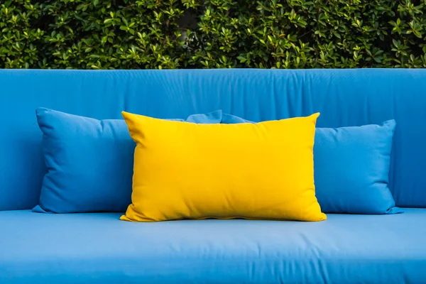 Outdoor patio in the garden with sofa chair and pillow decoratio