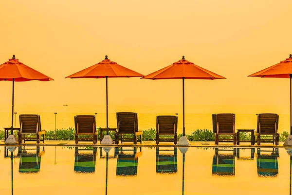 Beautiful sunrise around with umbrella and chair outdoor swimmin — 스톡 사진