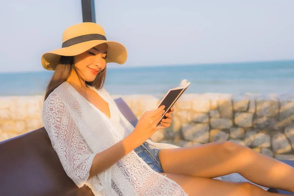 Portrait young asian woman read book around beach sea ocean — Stock Photo, Image