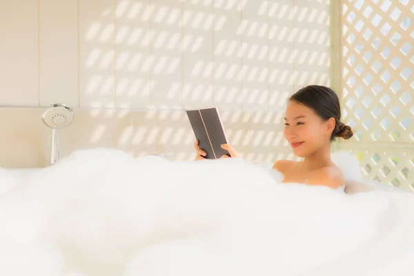 Portrait young asian woman read book in bathtub — 스톡 사진