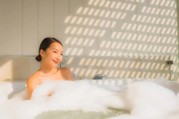 Portrait young asian woman relax take a bath in bathtub