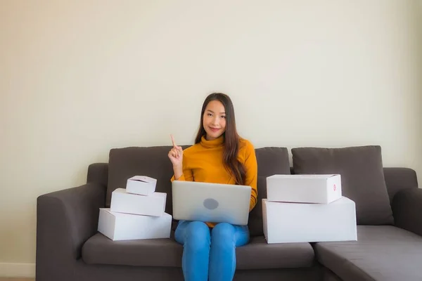 Portrait young asian woman using laptop computer for work with p — Stock Photo, Image