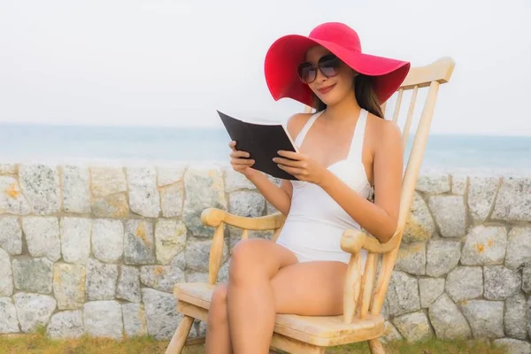 Portrait young asian woman read book around beach sea ocean — Stock Photo, Image