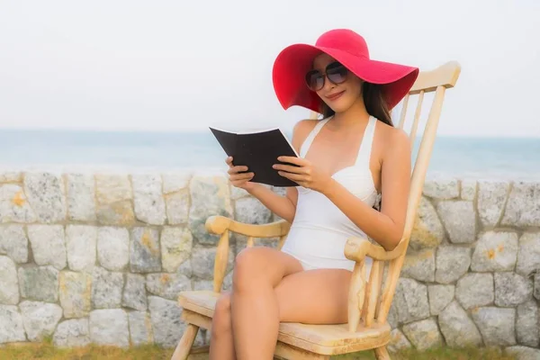 Portrait young asian woman read book around beach sea ocean — Stock Photo, Image