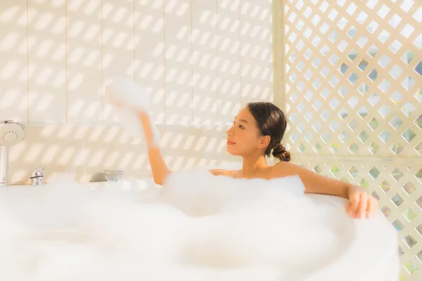 Portrait young asian woman relax take a bath in bathtub for spa concept