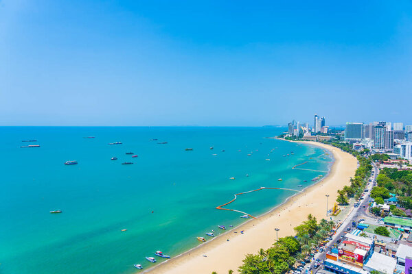Beautiful tropical beach sea ocean bay around white cloud blue sky and architecture building in Pattaya city Thailand