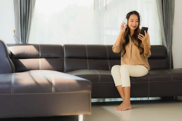 Portrait Beautiful Young Asian Woman Use Smartphone Cellphone Sofa Headphone — Stock Photo, Image