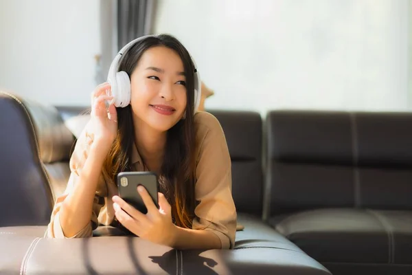 Portrait Beautiful Young Asian Woman Use Smartphone Cellphone Sofa Headphone — Stock Photo, Image