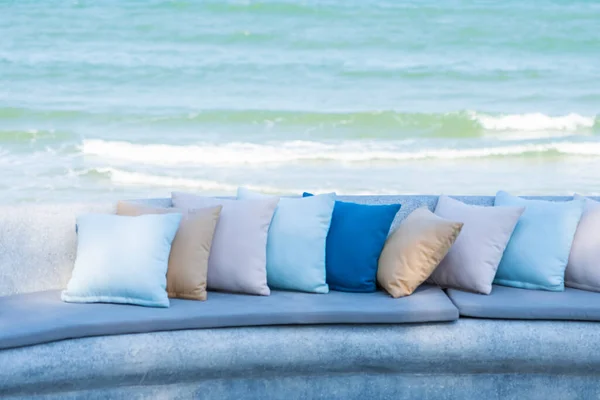 Pillow on chair or sofa lounge around outdoor patio with sea ocean beach view for travel