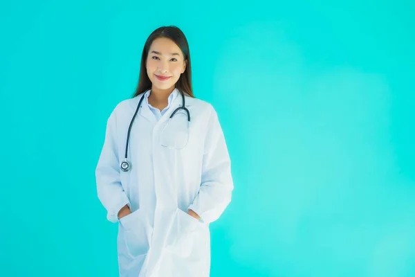 Portrait beautiful young asian doctor woman with stethoscope for use in clinic or hospital on blue isolated background
