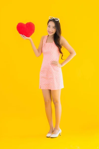 Portrait Beautiful Young Asian Woman Heart Pillow Sign Yellow Isolated — Stock Photo, Image