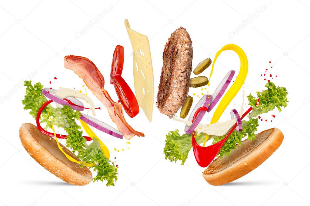hamburger cheeseburger explosion concept flying ingredients isolated on white background