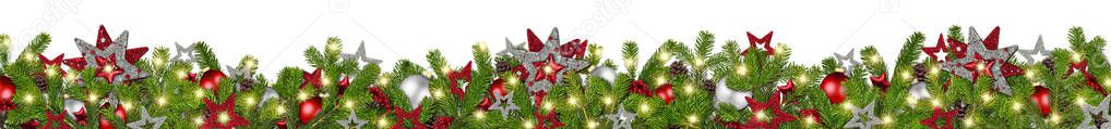 christmas garland super wide panorama banner with fir branches red silver stars lights and baubles xmas decoration isolated on white background