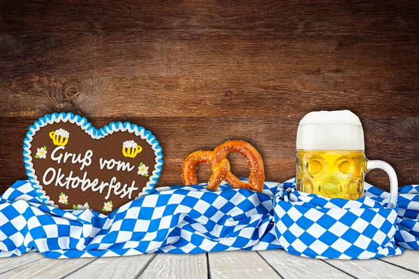 Oktoberfest background with beer mug bavarian flag and gingerbread heart