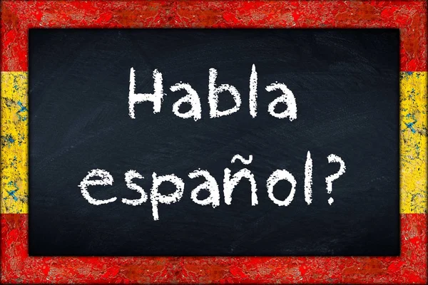 Habla espanol blackboard med Spanien flagga ram — Stockfoto