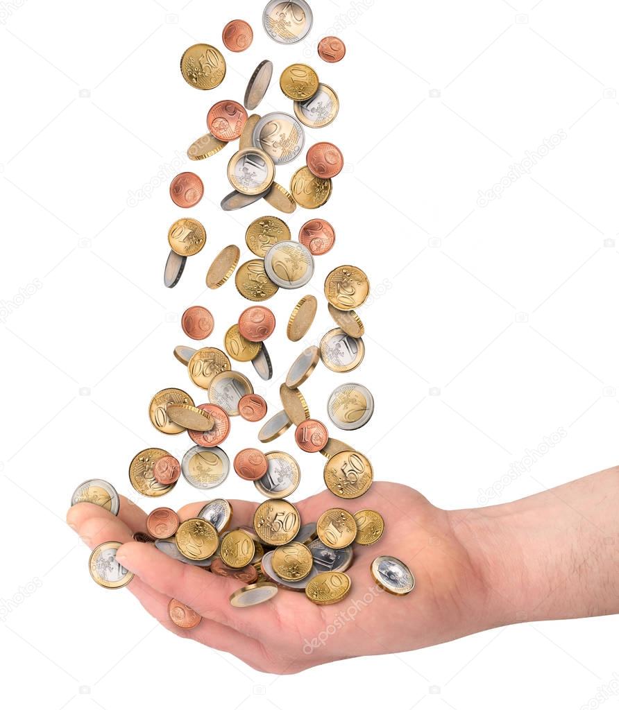 euzro coins falling in open hand