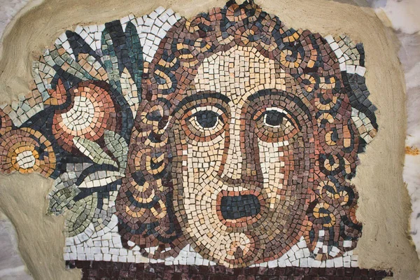 Ancient mosaic depicting a man\'s face