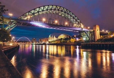 The Tyne Bridge over the river Tyne in Newcastle, GATESHEAD at night , ENGLAND. Best seller. clipart