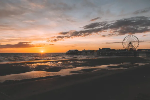 Blackpool Central Pier and Ferris Wheel, Lancashire, UK. Beautiful sunset, soft colours. Perfect evening.