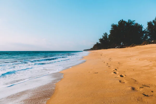 Landscape of tidal wave on the beach, gold sand, blue sky. Thailand