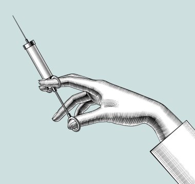 Kadın eli eski bir şırıngayla.