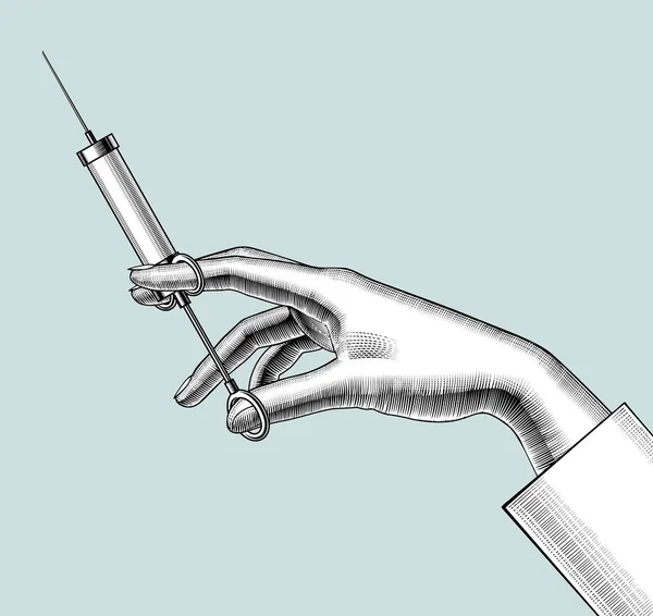 Femei mână cu o seringă retro . — Vector de stoc