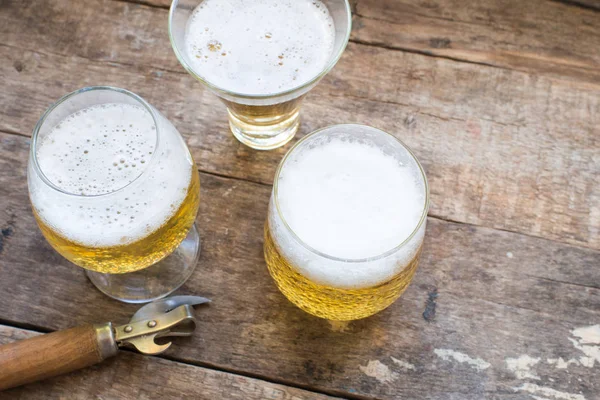 Beer in glasses on a wooden background — Stock Photo, Image