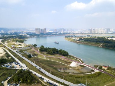 Aerial photography of high-rise buildings in the river basin and riverside park of the city of Nanning, Guangxi, China