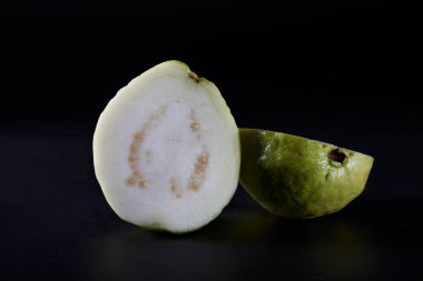 A juicy guava on a half cut close-up