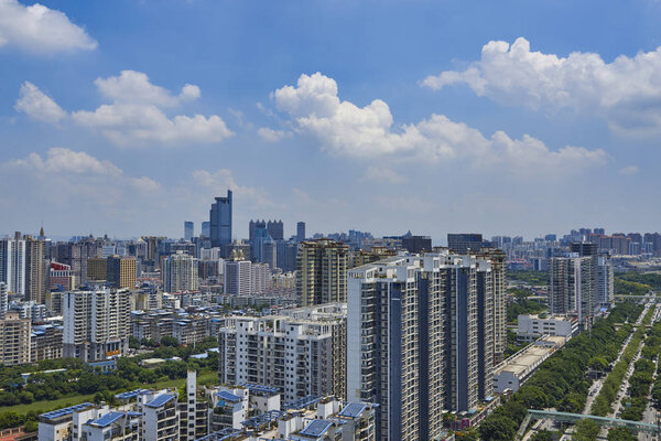 A bird's-eye view of high-rise buildings on Asian urban roads