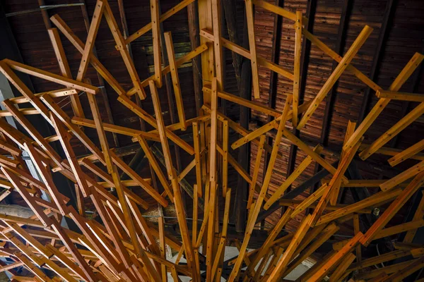 Roof design composed of messy wooden strips