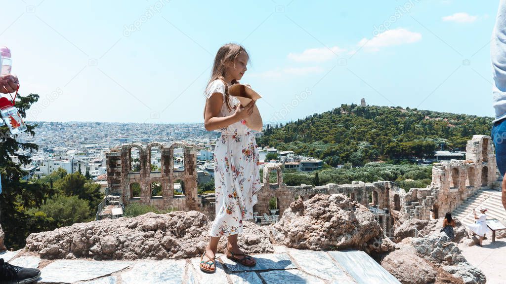 young girl in a dress of the ruins of the ancient city