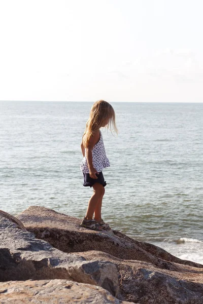 Small Girl Long Blonde Hair Standing Rocks — Stock Fotó