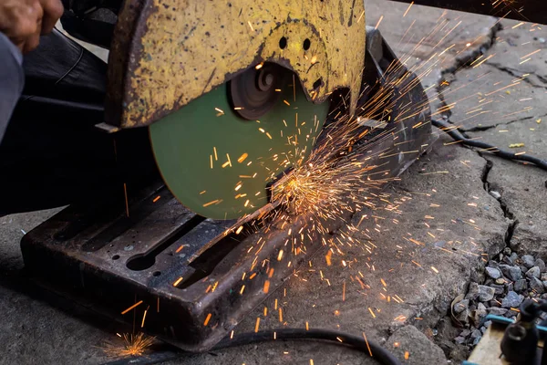 Closeup cutting process of metal material with sparks, industrial — Stock Photo, Image