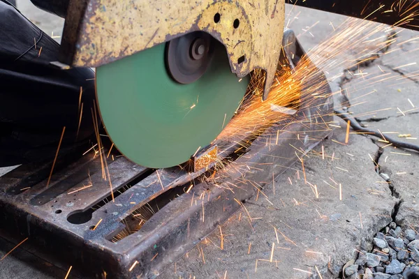 Closeup cutting process of metal material with sparks, industrial — Stock Photo, Image