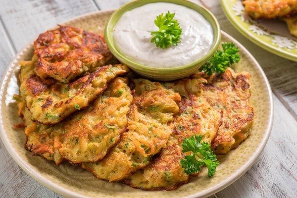Vegetable fritters with potato, carrot, zucchini served with Ranch sauce. — Stock Photo, Image