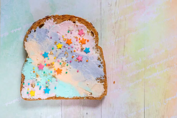 Unicorn food toasted bread with colorfur cream cheese — Stock Photo, Image