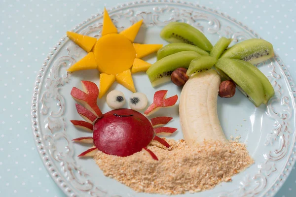 Fruit dessert for kid child with kiwi, banana and pear — Stock Photo, Image