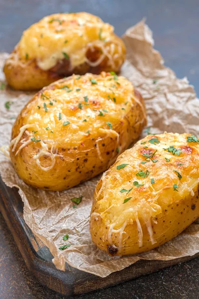 Baked loaded potato with bacon, cheese and onion — Stock Photo, Image