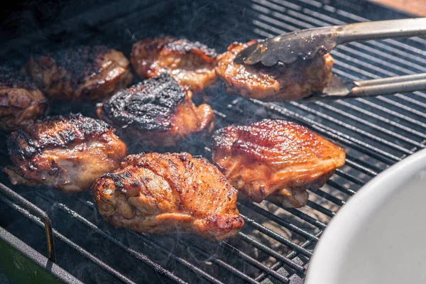 Grilled chicken thigh on the flaming grill — Stock Photo, Image