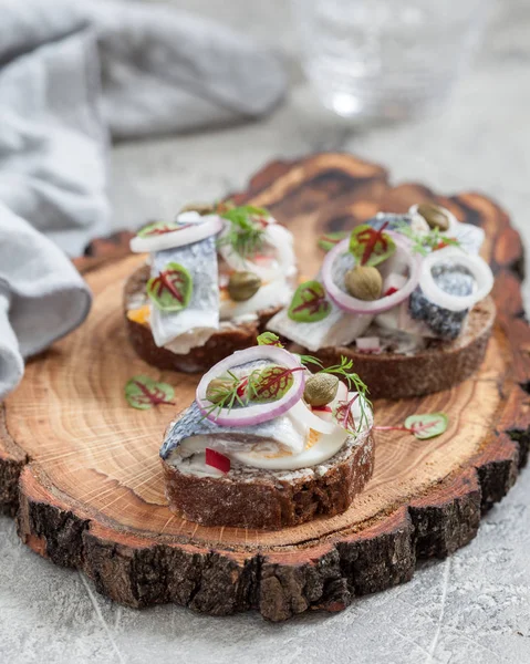 Open sandwich smorrebrod with herring, onion and eggs — Stock Photo, Image
