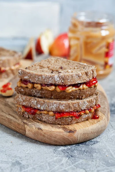 Peanut butter and strawberry jelly sandwich — Stock Photo, Image