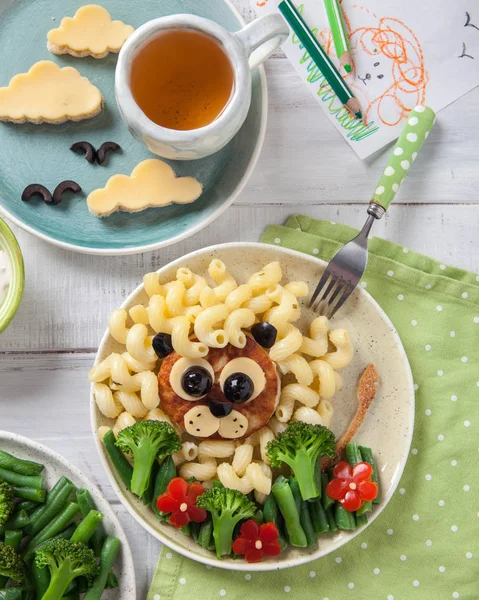 Funny Lion Food Face with Cutlet, Pasta and Vegetables